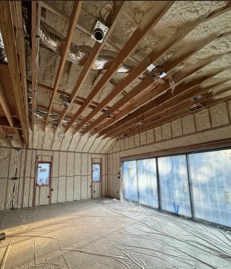 Interior walls and ceiling insulated with spray foam during new construction in Newbury